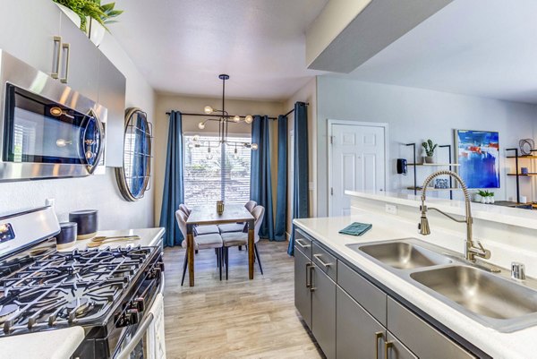 Spacious kitchen with modern appliances in Sunstone Apartments