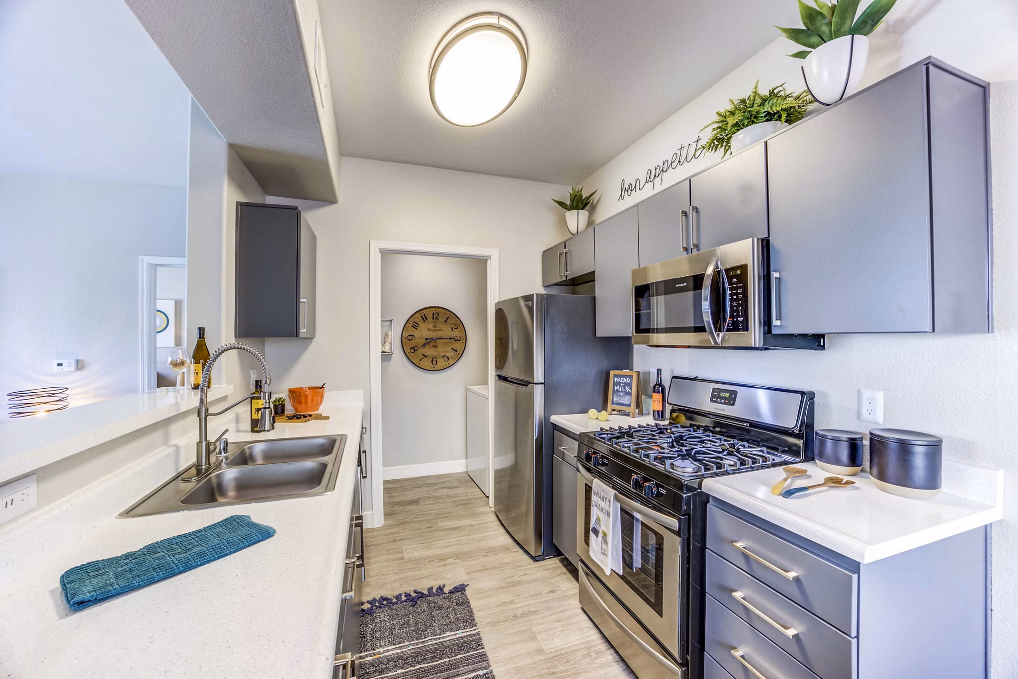 Modern kitchen with stainless steel appliances at Sunstone Apartments