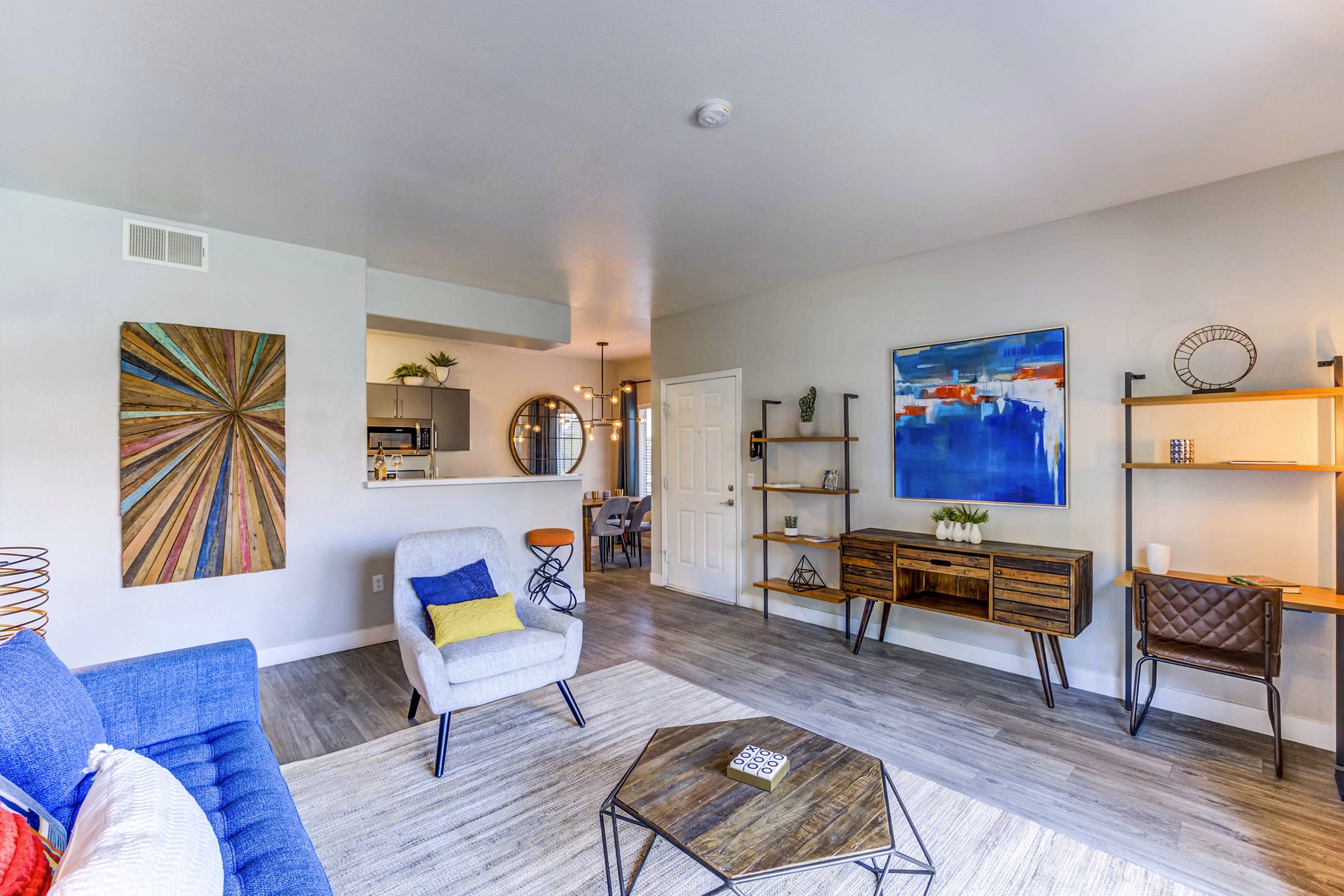 Modern living room with stylish dÃ©cor and ample natural light at Sunstone Apartments
