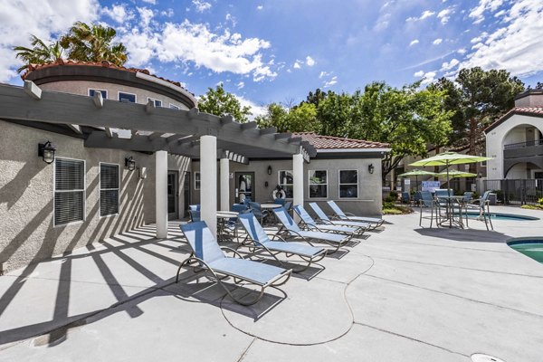 Outdoor pool with stylish patio at Sunstone Apartments luxury living