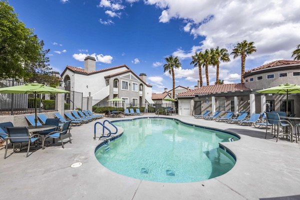 Sunstone Apartments: Outdoor pool with sun loungers and landscaped gardens, luxury living in a vibrant community