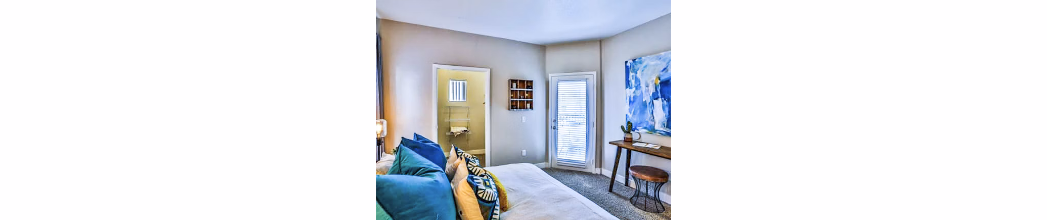 Spacious bedroom with modern decor at Solitude at Centennial Apartments