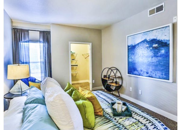 Elegant bedroom with modern decor at Solitude at Centennial Apartments