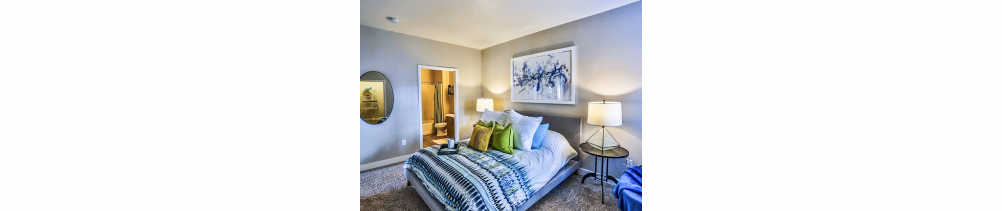 Cozy bedroom with modern design at Solitude at Centennial Apartments
