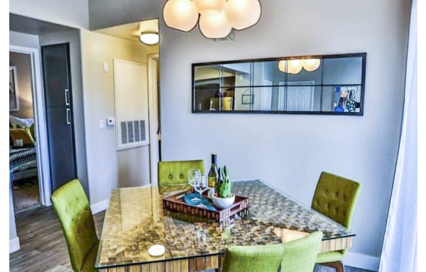 Dining room featuring modern decor and expansive windows in Solitude at Centennial Apartments