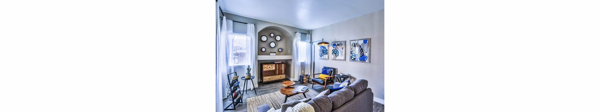 Spacious living room with modern decor in Solitude at Centennial Apartments