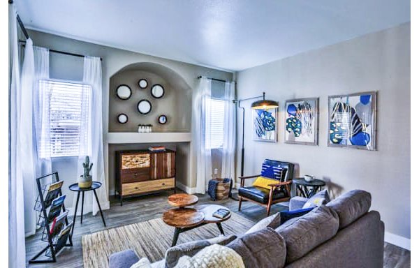 Spacious living room with modern decor in Solitude at Centennial Apartments