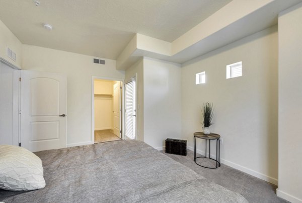 Spacious bedroom with modern decor at Central Park Commons Apartments