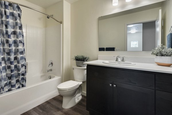 Bathroom with modern fixtures and elegant finishes at Central Park Commons Apartments