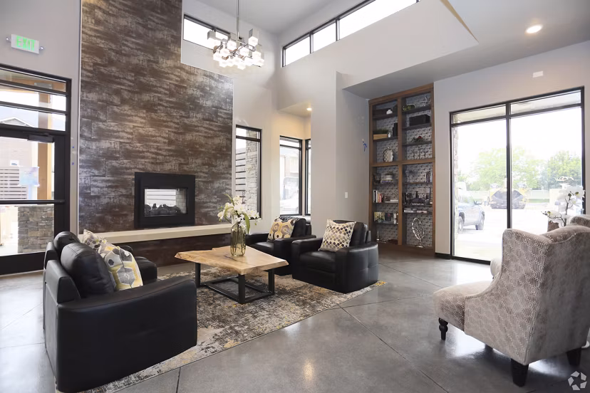 Clubhouse with modern amenities at Central Park Commons Apartments, featuring luxury interiors and ample seating, perfect for gatherings
