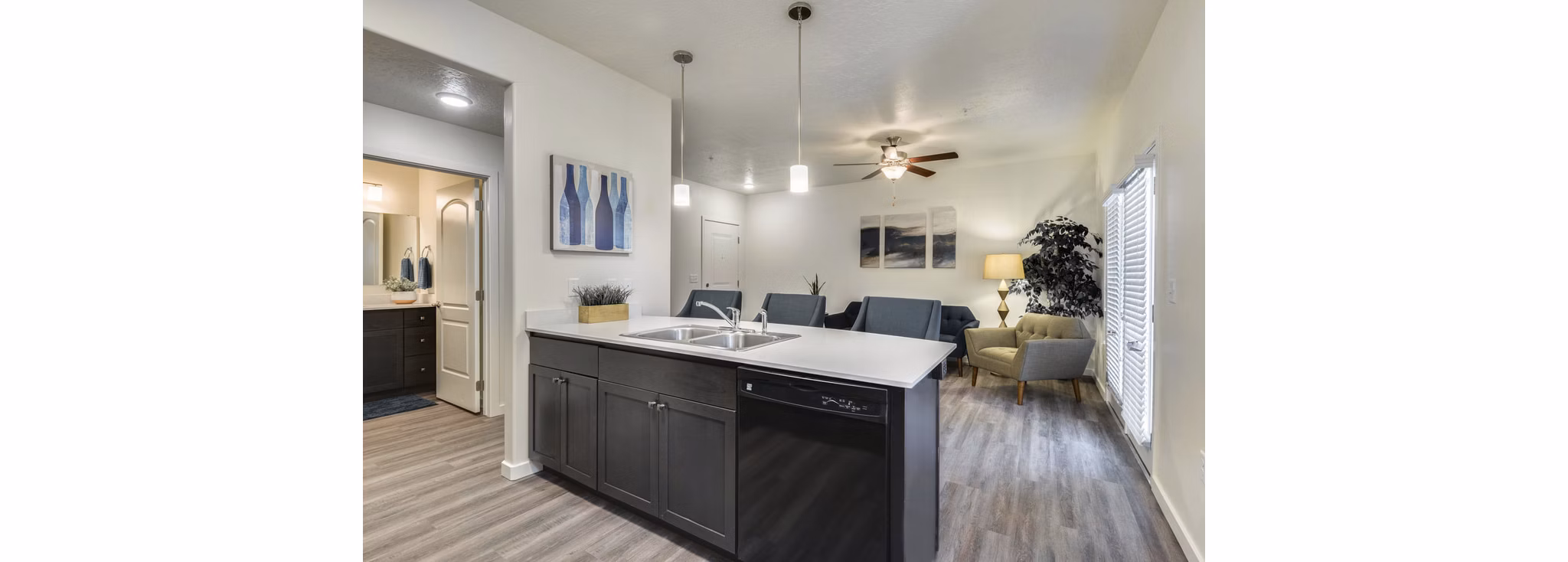 Modern kitchen with stainless steel appliances in Central Park Commons Apartments