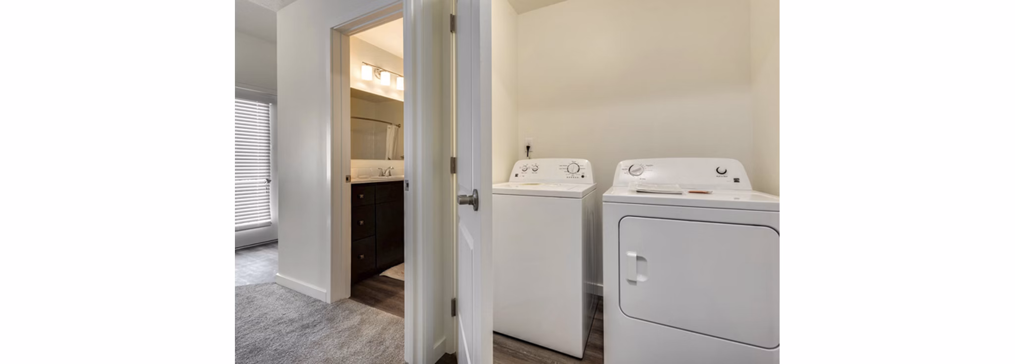 Laundry room with state-of-the-art appliances at Central Park Commons Apartments