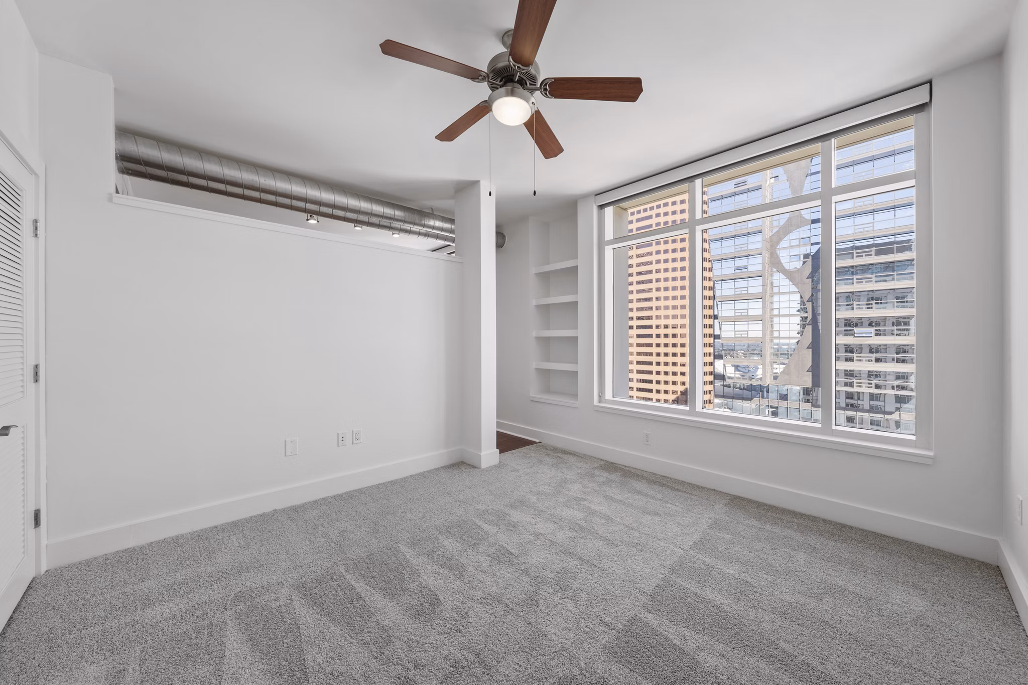 Cozy bedroom with modern decor at 717 Olympic Apartments in downtown Seattle