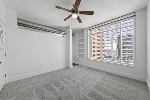Cozy bedroom with modern decor at 717 Olympic Apartments in downtown Seattle