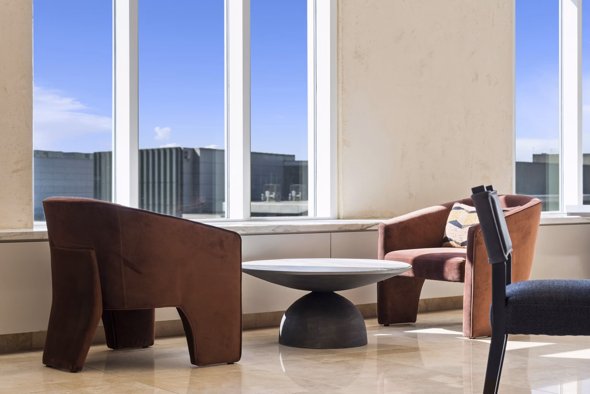 Clubhouse featuring modern decor and communal seating at 717 Olympic Apartments, a luxury property by Greystar in downtown Seattle