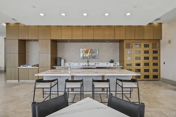 Clubhouse featuring modern seating and stylish decor at 717 Olympic Apartments in Los Angeles