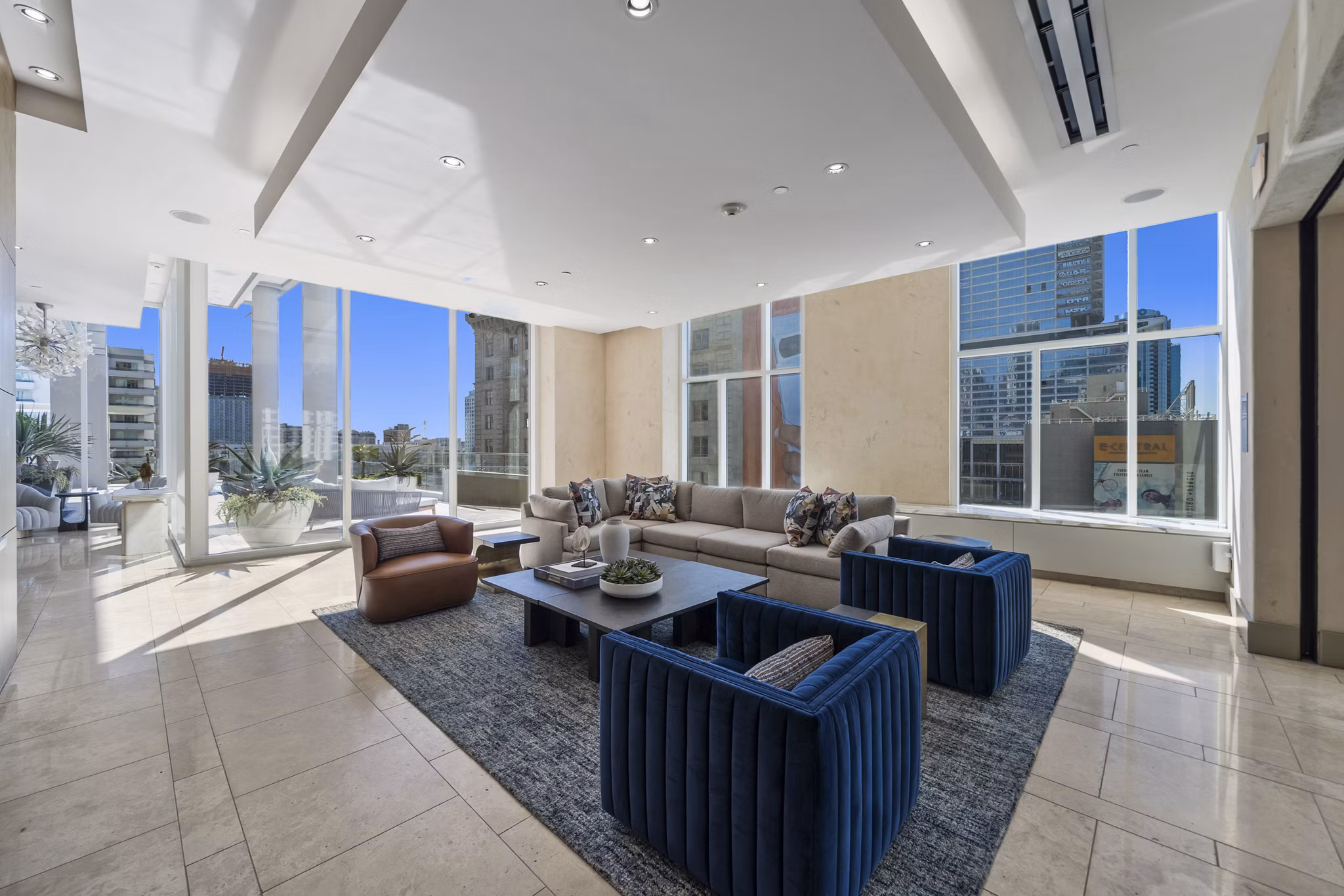 Modern clubhouse at 717 Olympic Apartments featuring luxury seating and decor in downtown Los Angeles