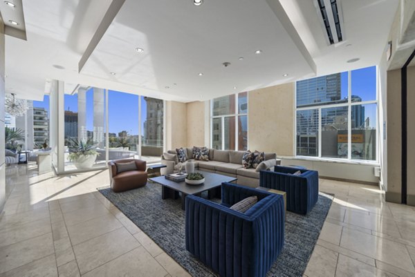 Modern clubhouse at 717 Olympic Apartments featuring luxury seating and decor in downtown Los Angeles