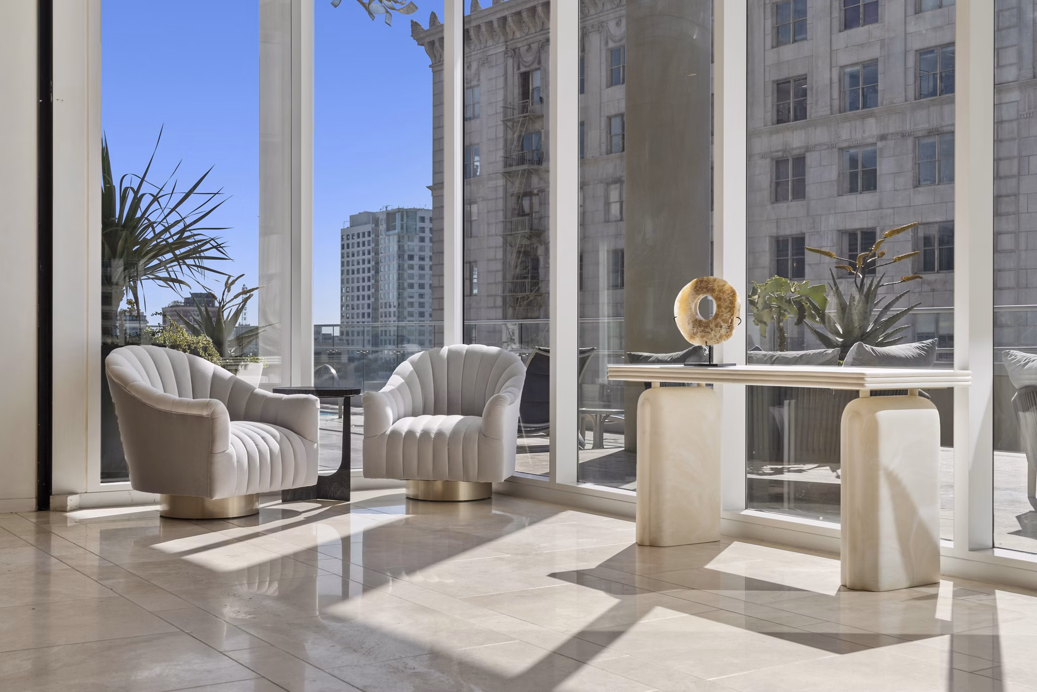 Modern clubhouse with stylish seating and entertainment areas at 717 Olympic Apartments in a vibrant community setting