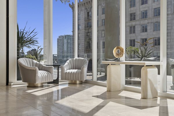 Modern clubhouse with stylish seating and entertainment areas at 717 Olympic Apartments in a vibrant community setting