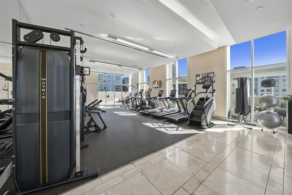 State-of-the-art fitness center at 717 Olympic Apartments with modern equipment for luxury workouts