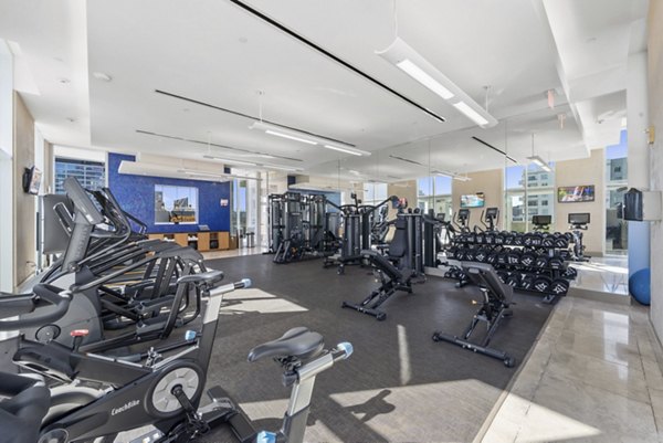 State-of-the-art fitness center with modern equipment at 717 Olympic Apartments