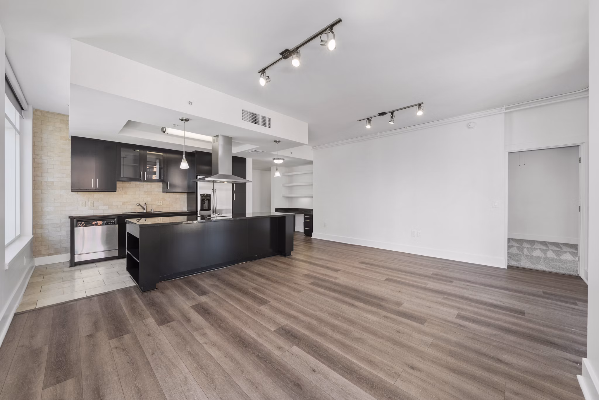 Expansive bedroom with city views at 717 Olympic Apartments