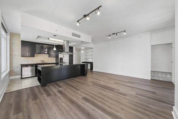 Expansive bedroom with city views at 717 Olympic Apartments