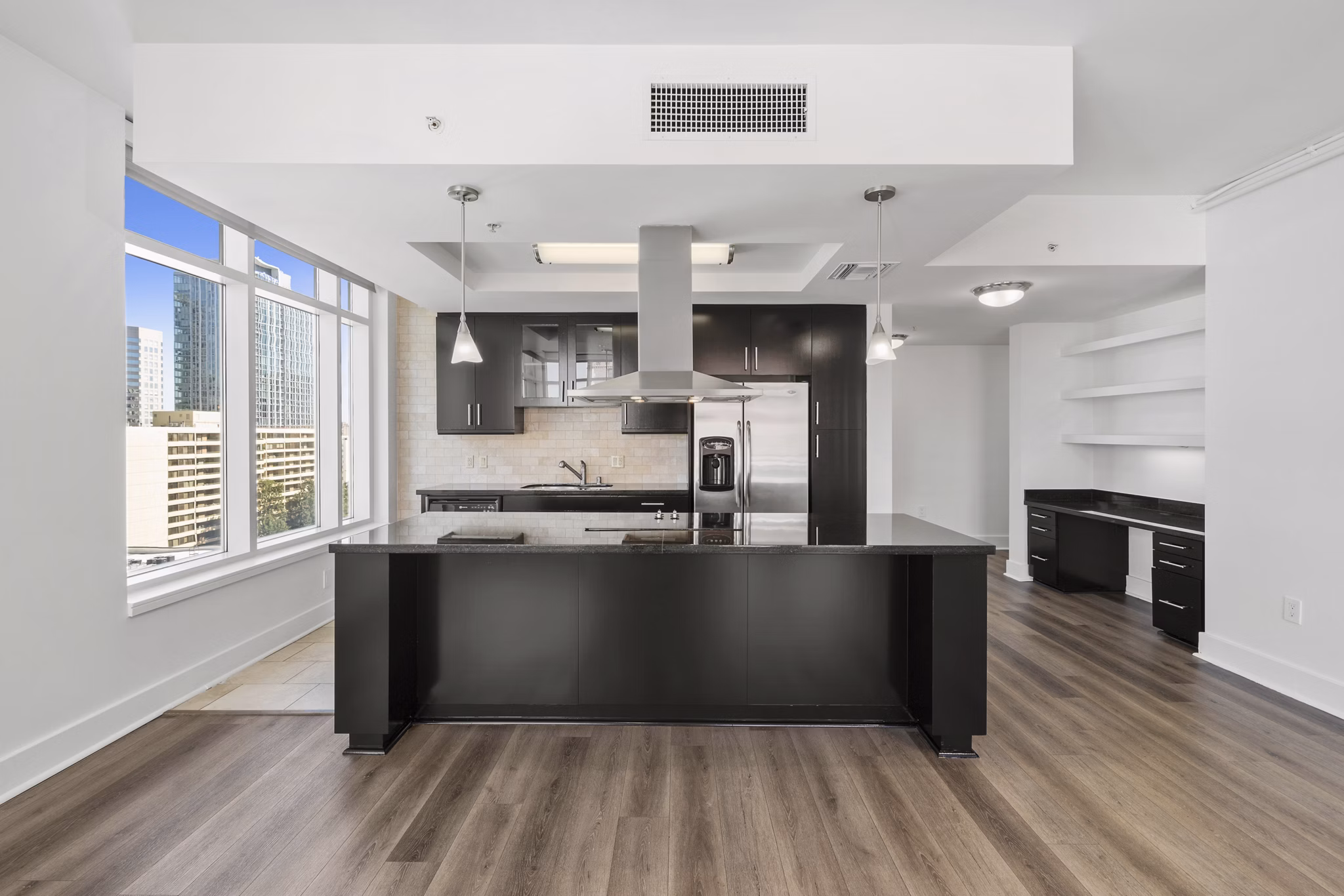 Kitchen featuring modern appliances and sleek design at 717 Olympic Apartments in luxury Greystar community