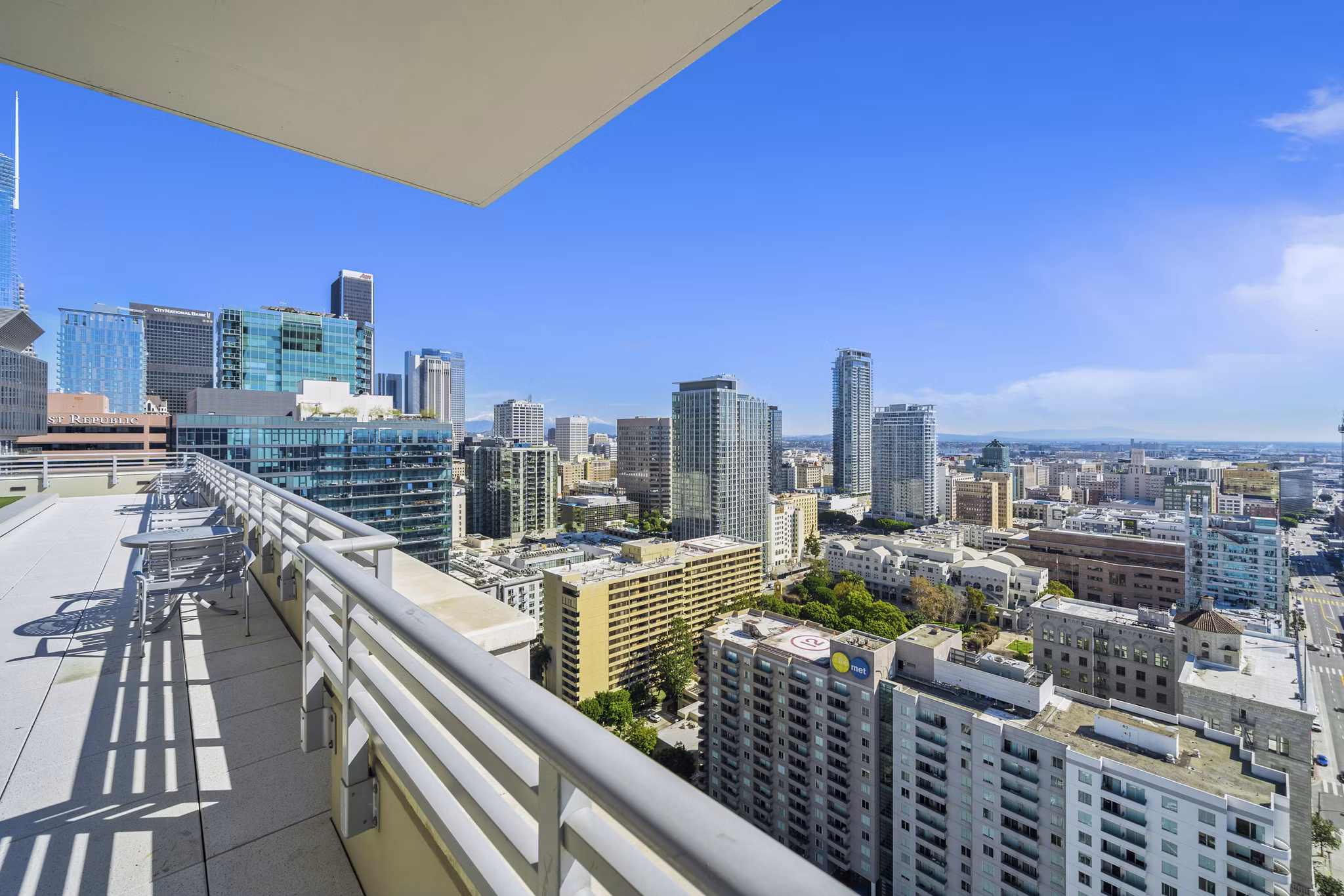 Rooftop deck with skyline views at 717 Olympic Apartments