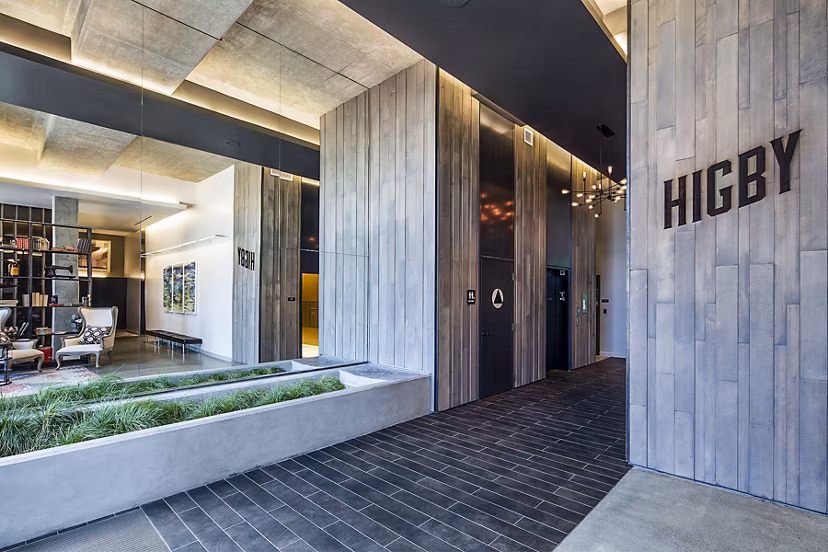 Higby Apartments: Modern clubhouse lobby featuring stylish seating and contemporary decor