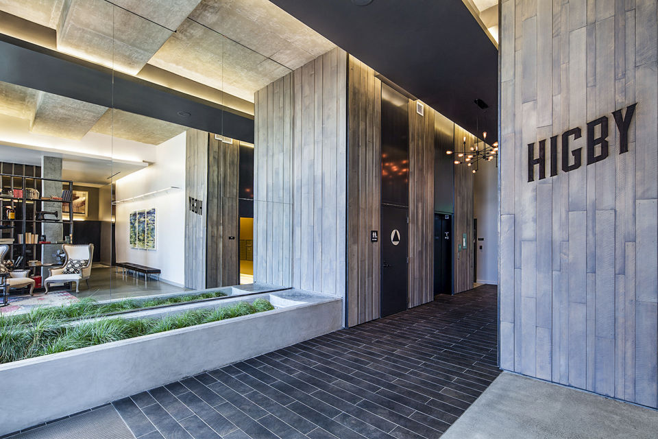Higby Apartments: Modern clubhouse lobby featuring stylish seating and contemporary decor