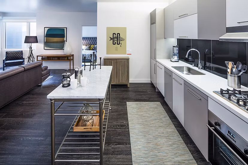 Modern kitchen with stainless steel appliances at Higby Apartments luxury homes in San Francisco