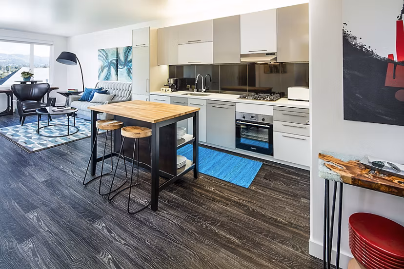Modern kitchen with stainless steel appliances at Higby Apartments