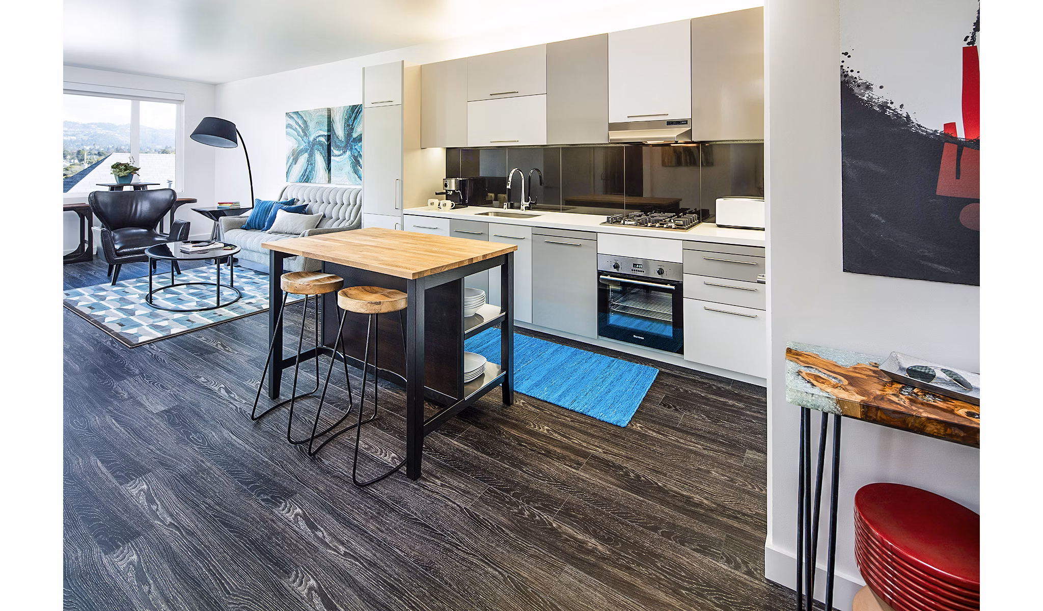 Modern kitchen with stainless steel appliances at Higby Apartments