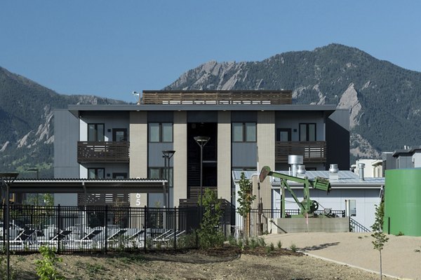 Alexan Diagonal Crossing: Modern luxury apartments with lush landscaping in Boulder