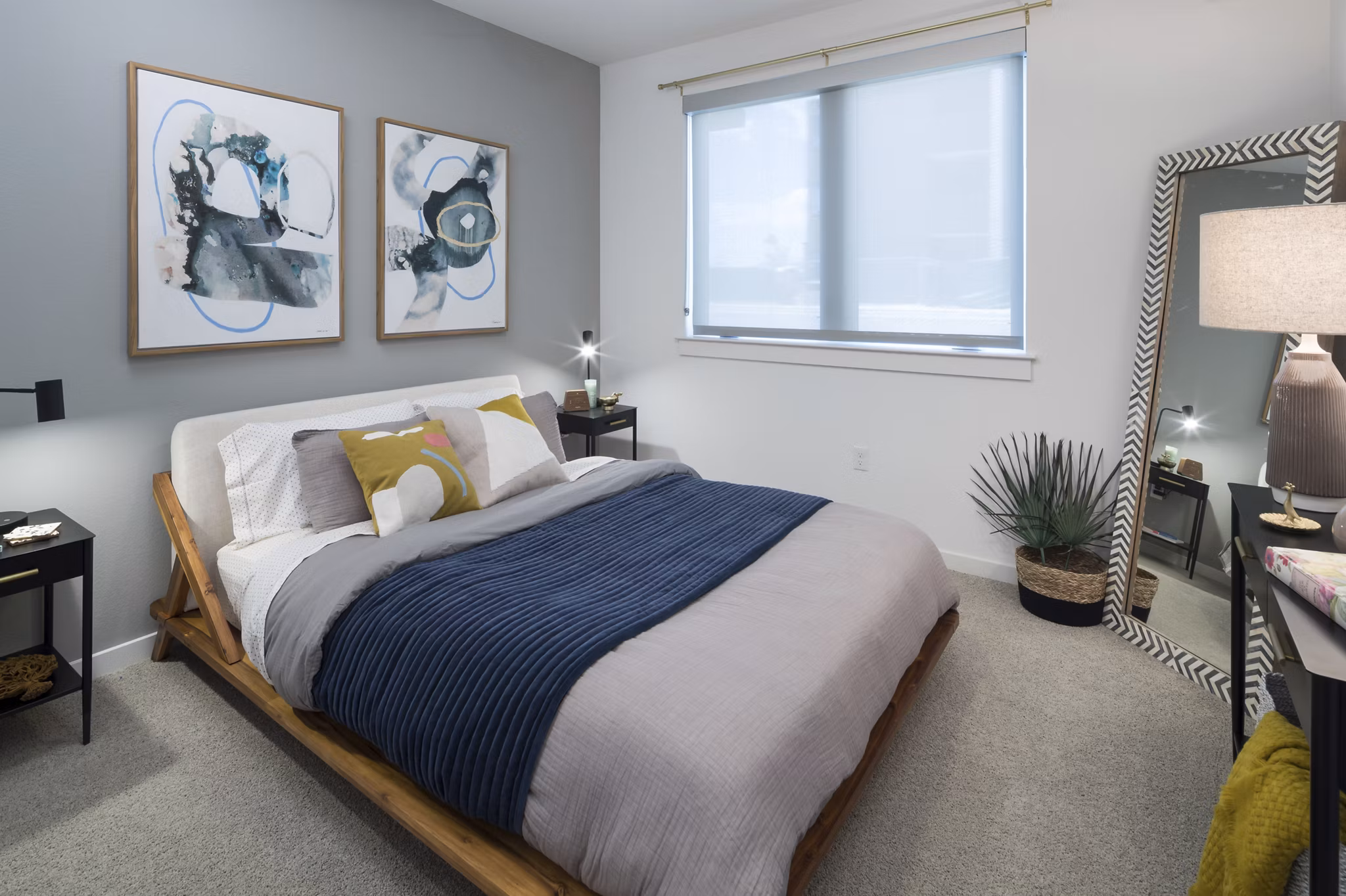 Cozy bedroom featuring modern decor in Alexan Diagonal Crossing Apartments