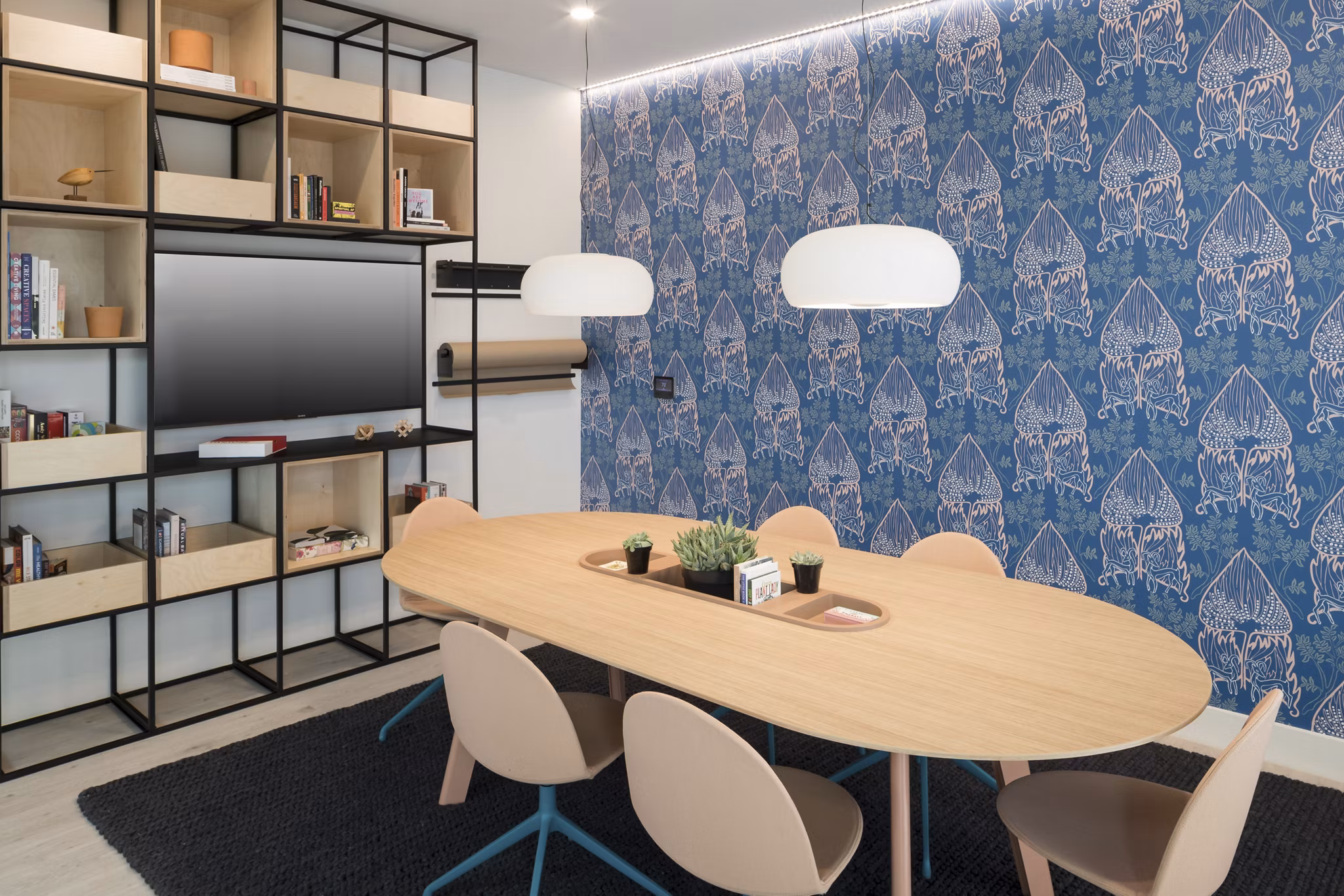 Modern meeting facility with advanced tech and seating at Alexan Diagonal Crossing Apartments, ideal for business gatherings and conferences