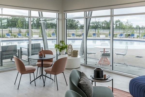 Clubhouse with modern design elements at Alexan Diagonal Crossing Apartments in a luxury Greystar community