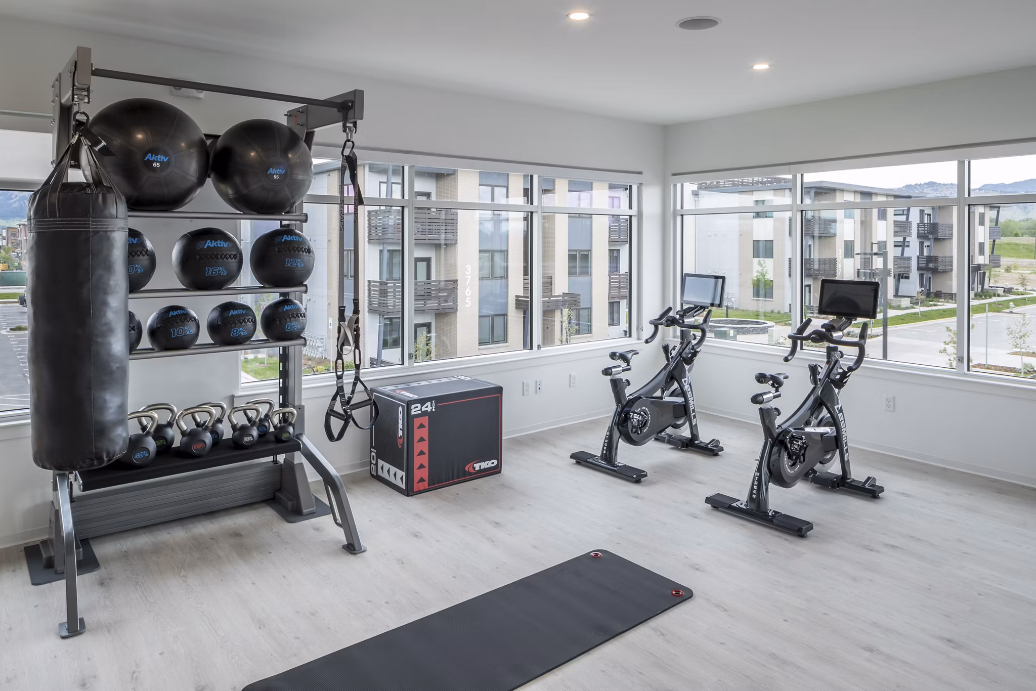 Fitness center with modern equipment at Alexan Diagonal Crossing Apartments