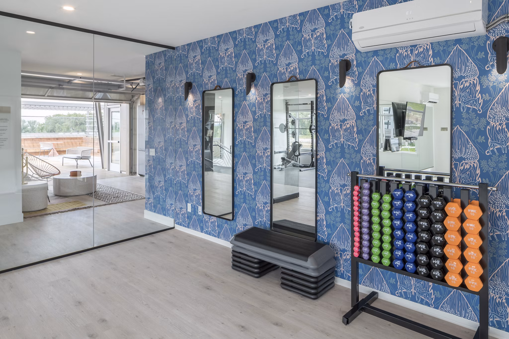 State-of-the-art fitness center with modern equipment at Alexan Diagonal Crossing Apartments