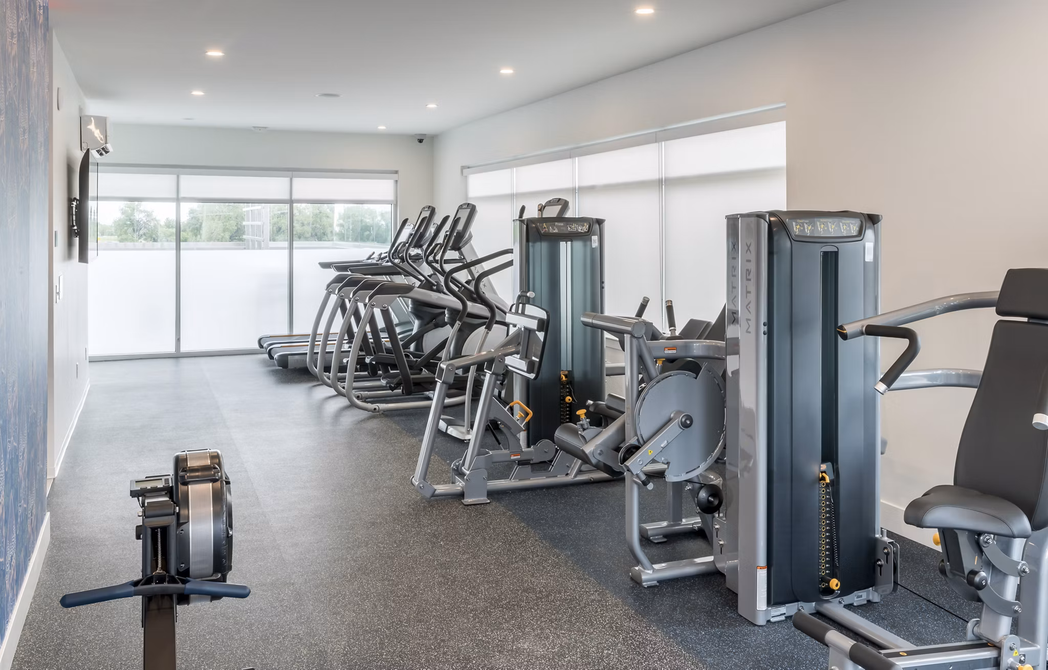 Fitness center featuring modern equipment at Alexan Diagonal Crossing Apartments