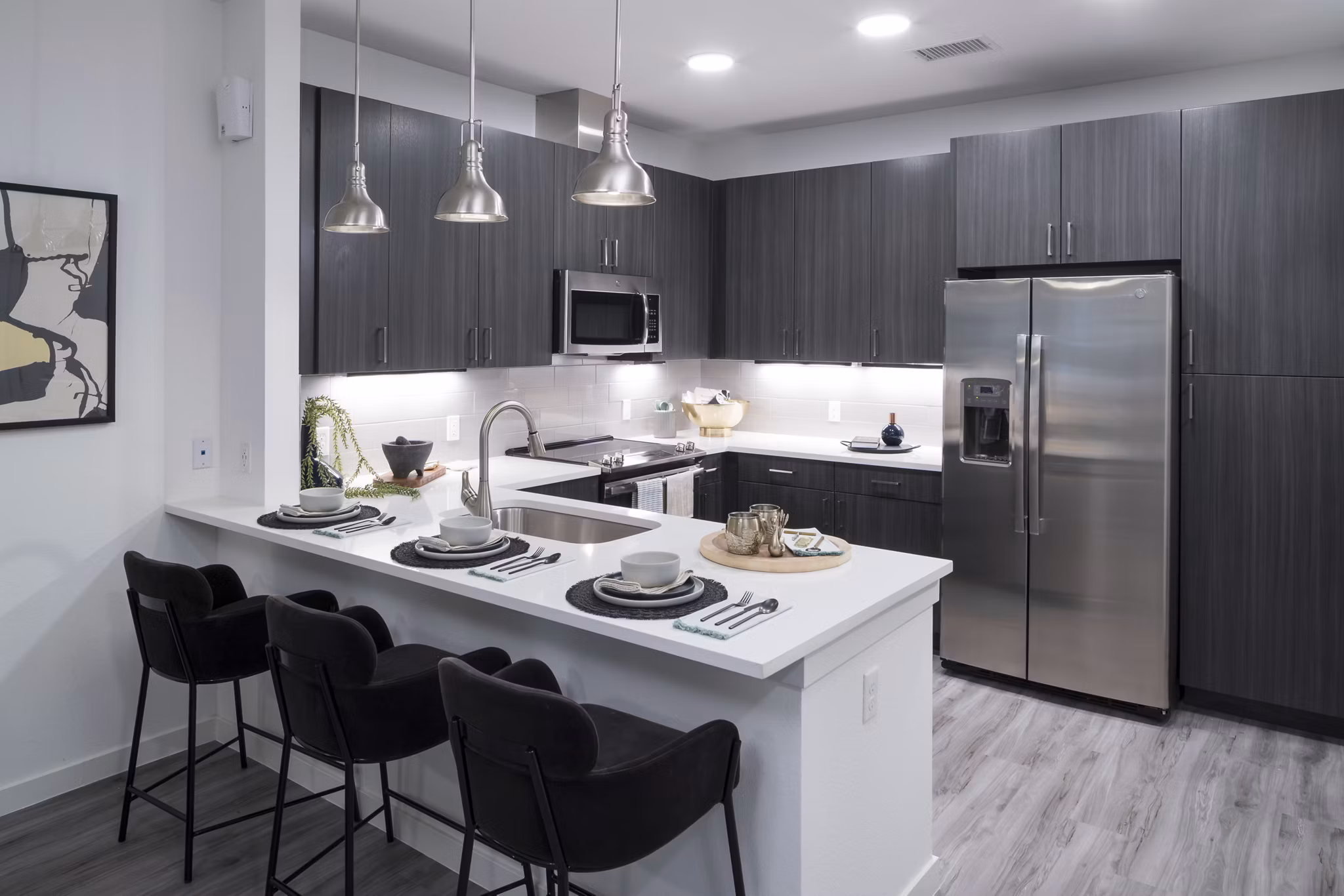 Modern kitchen featuring elegant countertops and stainless steel appliances at Alexan Diagonal Crossing Apartments