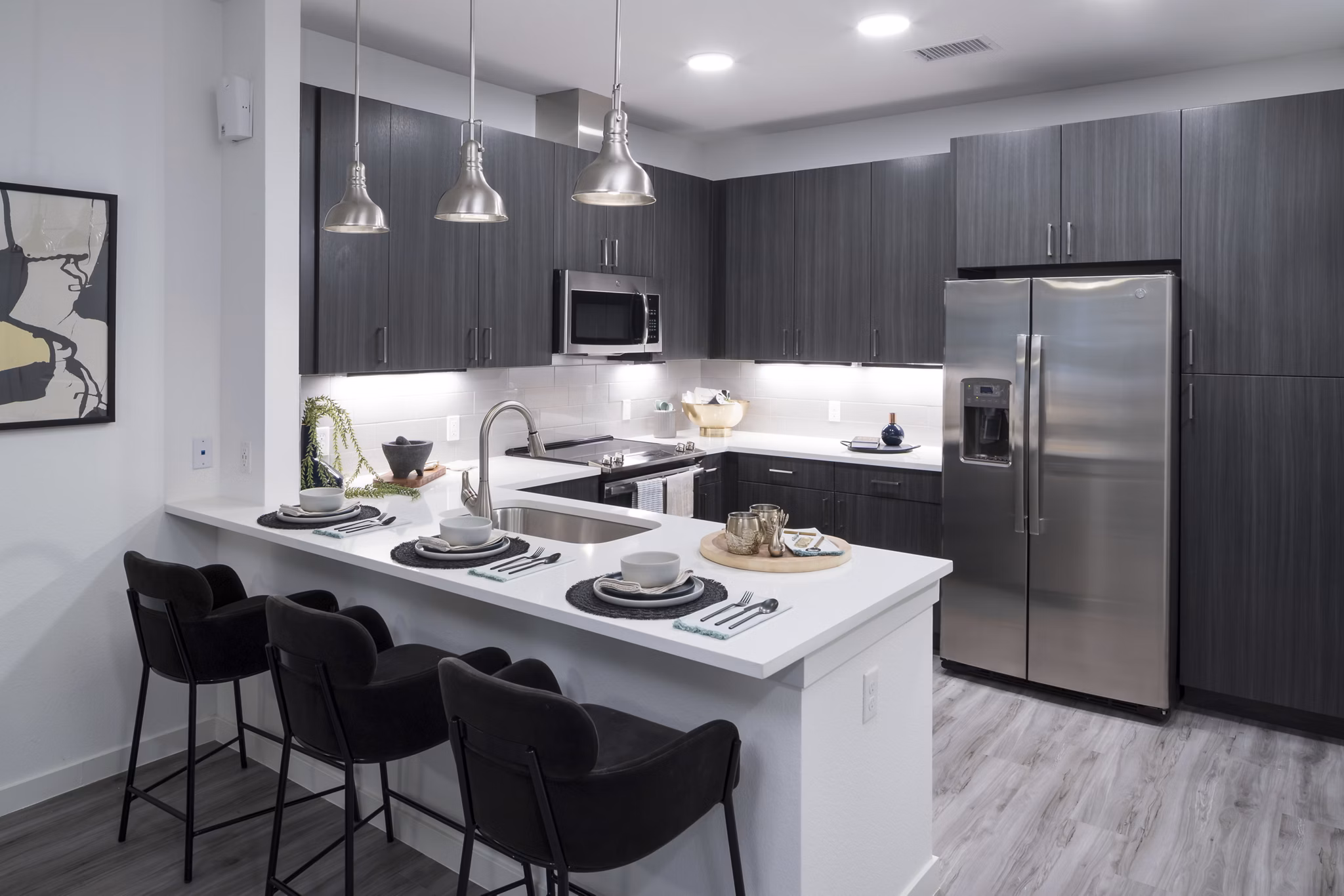 Modern kitchen featuring elegant countertops and stainless steel appliances at Alexan Diagonal Crossing Apartments