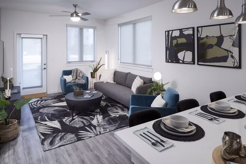 Spacious living room with minimalist design in Alexan Diagonal Crossing Apartments