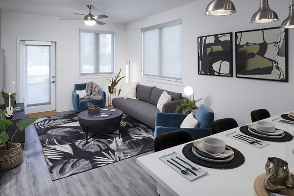 Spacious living room with minimalist design in Alexan Diagonal Crossing Apartments