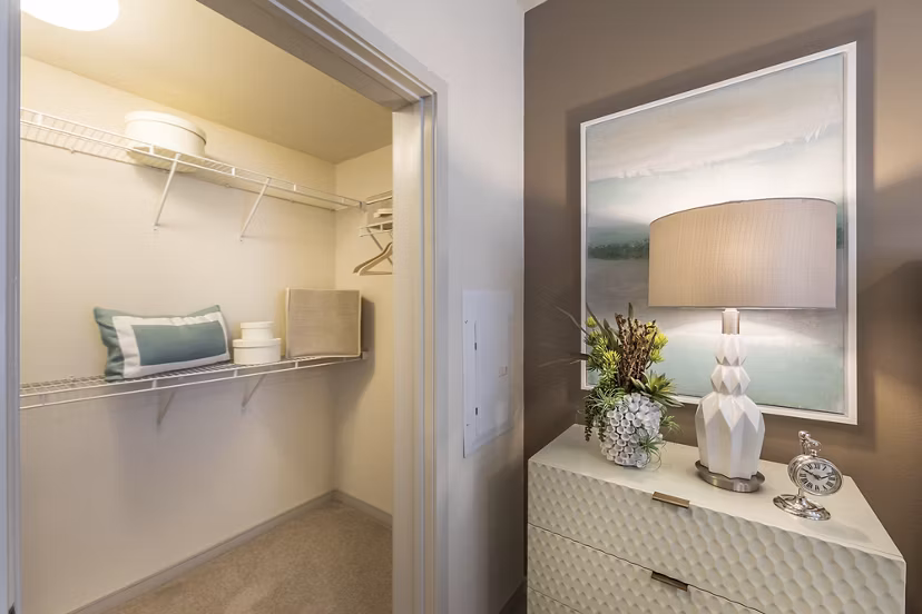 Cozy bedroom featuring stylish decor and large windows at Areum Apartments