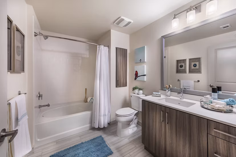 Modern bathroom with sleek fixtures and marble countertop at Areum Apartments