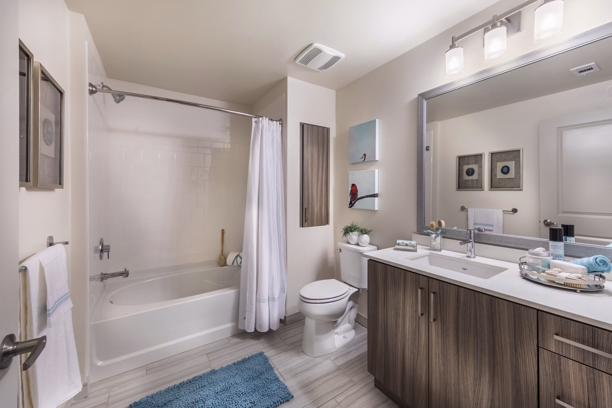 Modern bathroom with sleek fixtures and marble countertop at Areum Apartments