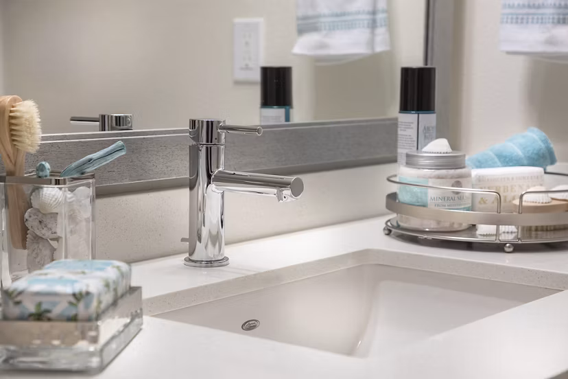 Elegant bathroom with marble accents and spacious shower at Areum Apartments, offering a luxury living experience in a Greystar community